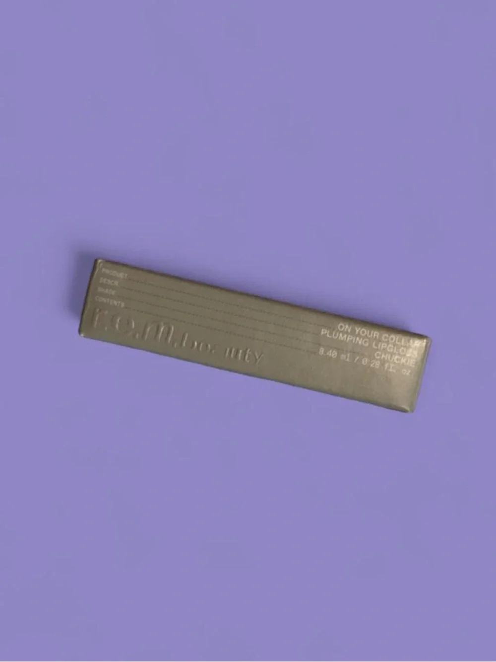 R.E.M. Beauty Plumping Iridescent Purple Lip Gloss in shade Chuckie